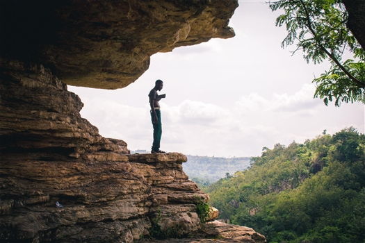 Best hiking places in Ghana<br>Man on boulder