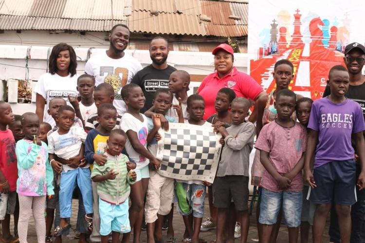 Street Chess - Group pic holding chess board
